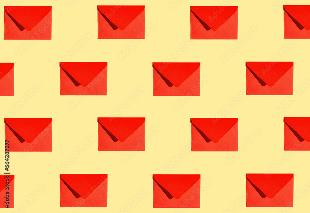Creative pattern made of red paper envelope on yellow background. Minimal style. Greeting letter and mail concept. Creative pattern made of red paper envelope on yellow background. Minimal style. Greeting letter and mail concept.
