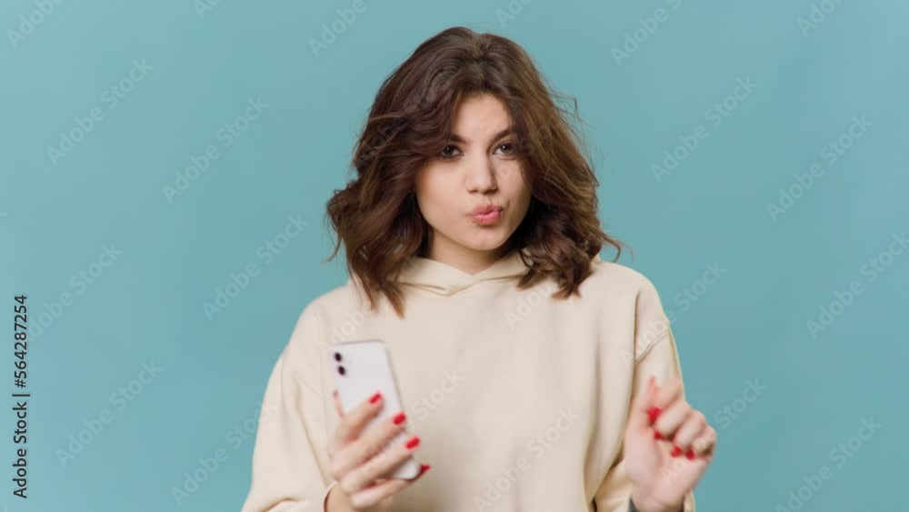Portrait of Happy cute gorgeous and happy brunette woman listening to music on mobile smartphone Portrait of Happy cute gorgeous and happy brunette woman listening to music on mobile smartphone