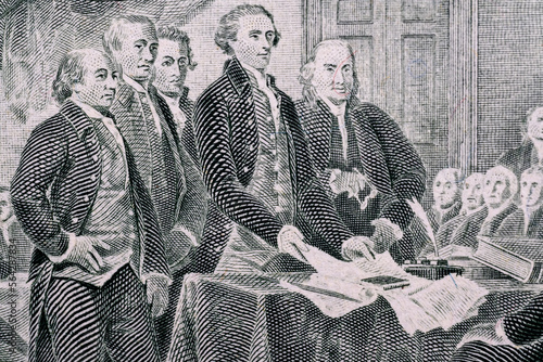 A fragment of the painting "Declaration of Independence" by J. Trumbull on a two-dollar bill.