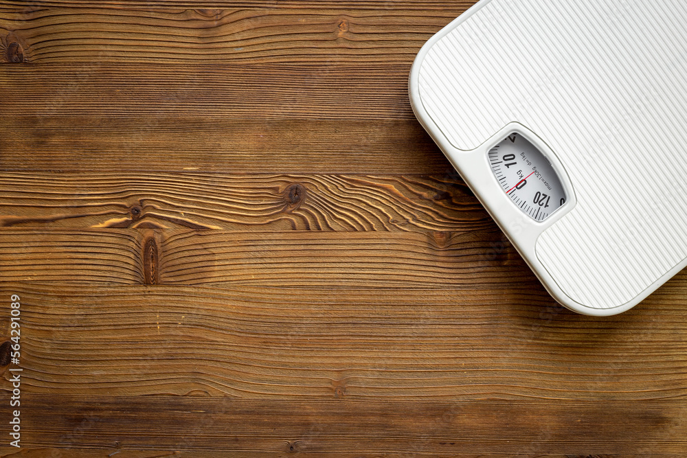 White weight scales on the floor. Weight measurement and loss concept White weight scales on the floor. Weight measurement and loss concept