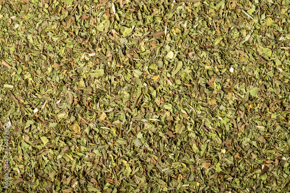 Dried mint, cut into pieces as a background with many details. Food background. Dry spice concept. Top view Dried mint, cut into pieces as a background with many details. Food background. Dry spice concept. Top view