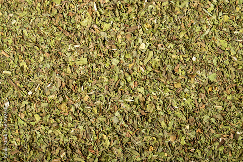 Dried mint, cut into pieces as a background with many details. Food background. Dry spice concept. Top view