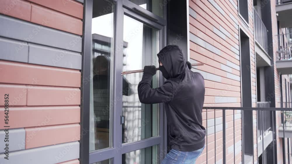 Burglar robber break door lock entering building apartment house robbery Home Burglary intruder or thief stealing private property indoor after hearing the activation alarm alert run away outdoor Burglar robber break door lock entering building apartment house robbery Home Burglary intruder or thief stealing private property indoor after hearing the activation alarm alert run away outdoor