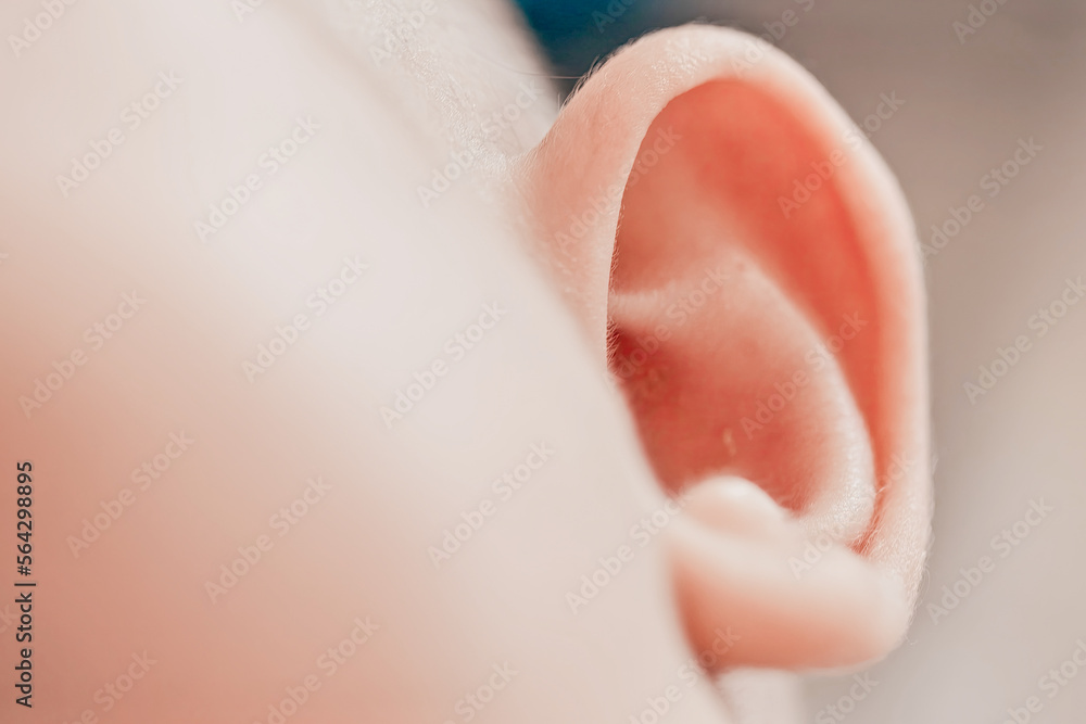 Close-up of a baby's face. Lovely ear. A cute baby Close-up of a baby's face. Lovely ear. A cute baby