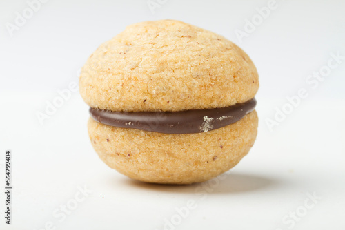 Studio shot close up on baci di dama, northern italian cookie recipe, resting on white background.