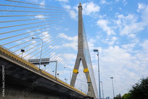 Thailand, Bangkok, view of the Rama VIII Bridge and the Chao Praya river under blue sky. © waranyaphoto