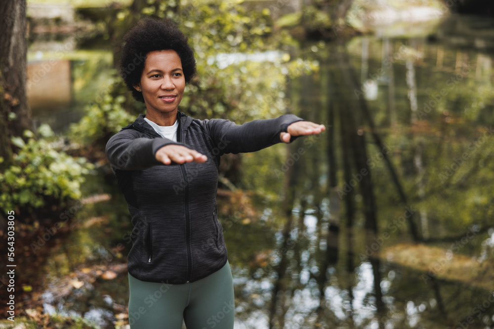 Black Woman Warming Up Before Jogging In Nature Black Woman Warming Up Before Jogging In Nature