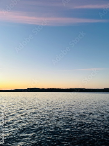Evening lake view  sky reflection on the lake surface  idyllic lake horizon 