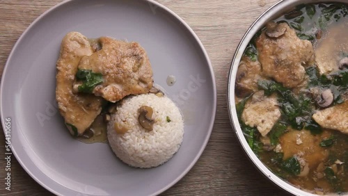 Turkey fillet cooking chop in sauce with green leaves