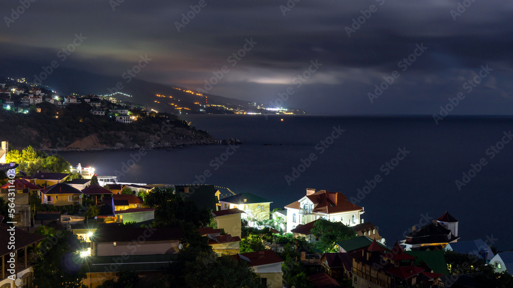 the view from foros in the Eastern part of the coastline in the night lights