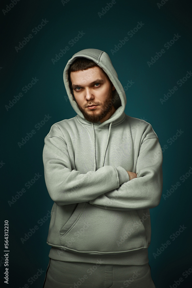 bearded man in sweatshirt on gray background. bearded man in sweatshirt on gray background.