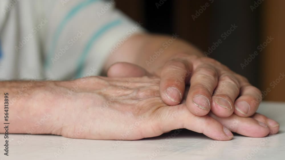 the hands of an elderly person folded on top of each other, a pensioner is thinking while sitting at a table, depression in the elderly, senile dementia, the hands of an elderly person folded on top of each other, a pensioner is thinking while sitting at a table, depression in the elderly, senile dementia,