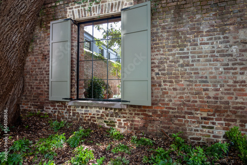Window in a brick wall to a courtyard