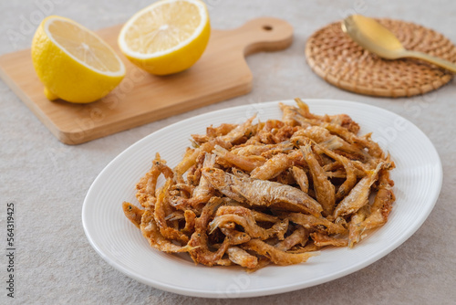 Wallpaper Mural Crispy fried small fish on white plate Torontodigital.ca