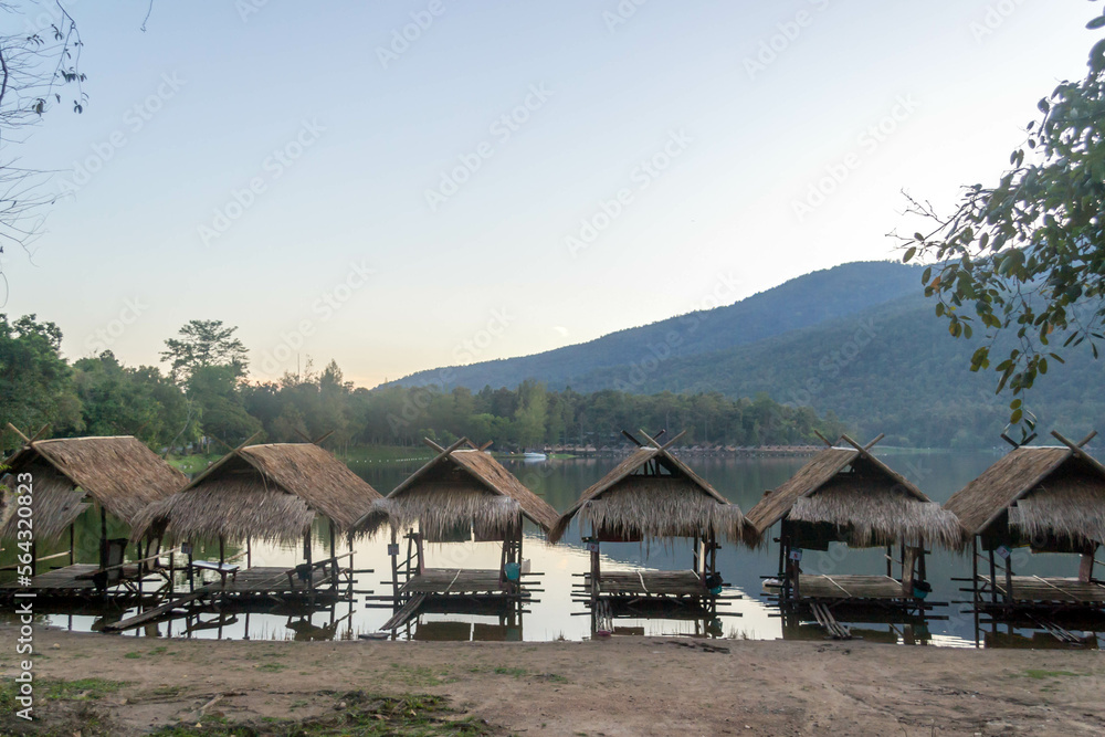 Straw floating huts on the water at Huay Tueng Thao Reservoir in Chiang Mai, Thailand.