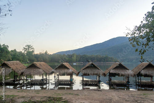 Straw floating huts on the water at Huay Tueng Thao Reservoir in Chiang Mai, Thailand. © Danica Chang