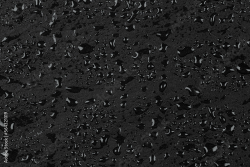 Water drops on dark stone