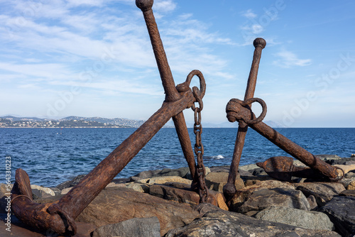 Old rusty anchors on the pier in St. Tropez
