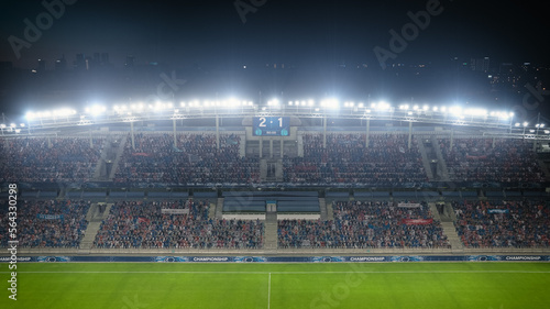Football Soccer Stadium Championship Match, Scoreboard Screen Showing Score of 2:1. Crowd of Fans Cheering, Screaming, Having Fun. Sports Channel Television Advertising Concept. Wide Shot.