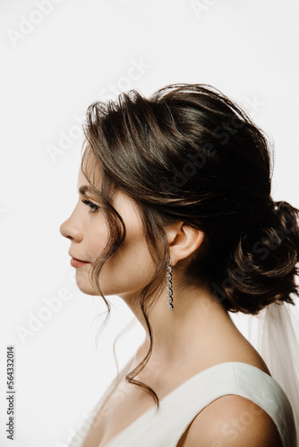 close-up portrait of the bride in profile on a white background