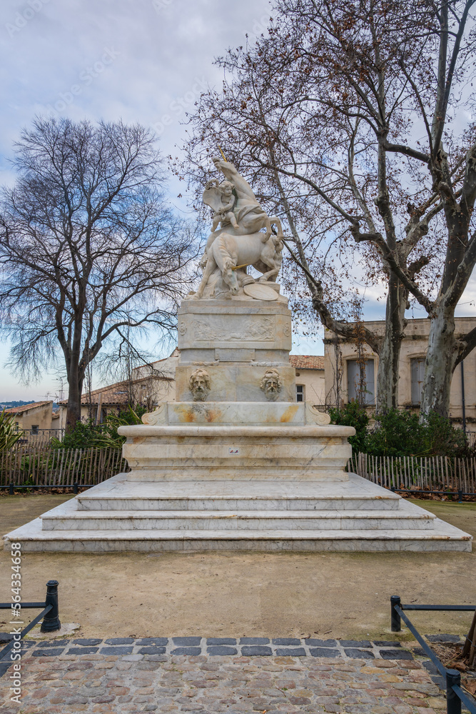 Vertical view of the ancient white marble fountain of the unicorns or fontaine des licornes monument on Canourgue square, Montpellier, France
