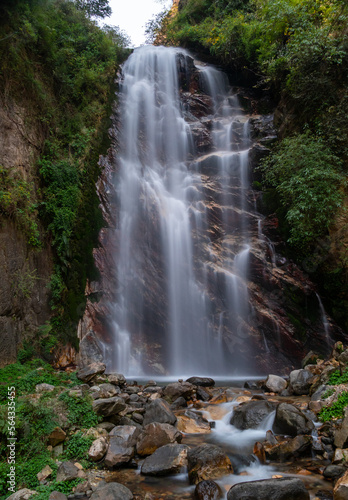 Himachal, India - April 7th, 2022 : waterfall in mountains of himalayas