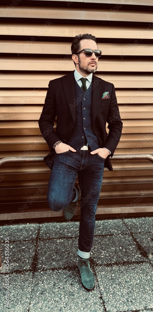 Handsome man in jacket and jeans.  - obrazy, fototapety, plakaty 