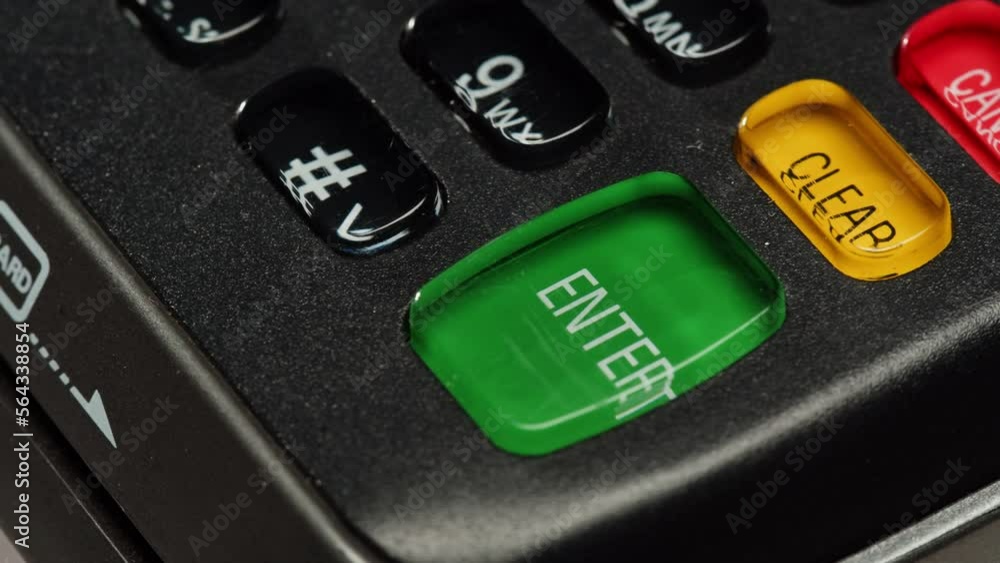 Close up of NFC terminal in the shop. Macro shot of Men pays by card in banking terminal.