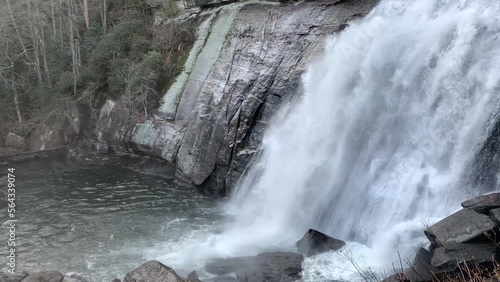 Misty mountain waterfall on a cloudy day