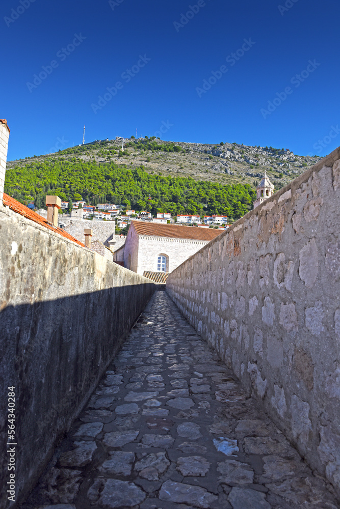 Walk on the ancient, defensive city wall in Dubrovnik, Croatia at the Dalmatian Coast of the Adriatic Sea