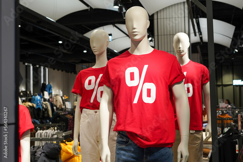 Mannequins in a shop. Sale of clothes for men and women