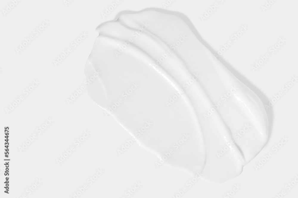 White beauty cream smear smudge on white background. Cosmetic skincare product texture. Face cream, body lotion swipe swatch White beauty cream smear smudge on white background. Cosmetic skincare product texture. Face cream, body lotion swipe swatch