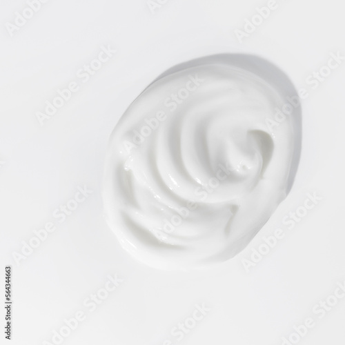 White beauty cream smear smudge on white background. Cosmetic skincare product texture. Face cream, body lotion swipe swatch © LeviaUA