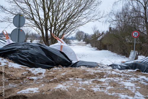 Jekabpils, Latvia - January 24, 2023: The Latvian city of Jekabpils after the devastating floods that started in the city in January. The tunnel is equipped with a temporary protective wall photo