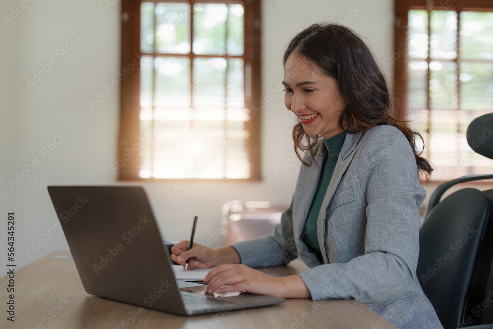 Asian Business woman working at home office and analyze financial report document. Accounting and Finance concept. Asian Business woman working at home office and analyze financial report document. Accounting and Finance concept.