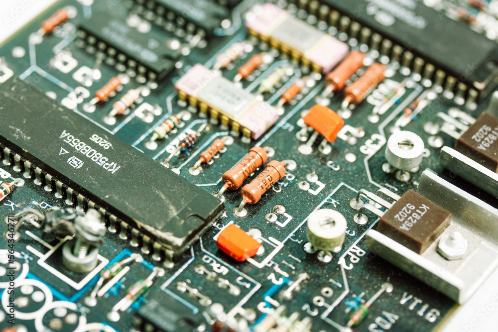 Green yellow motherboard background and texture. Production of circuit board, electronic computer components. Software engineering, hardware technology. Technological digital backdrop wallpaper. Chip. Green yellow motherboard background and texture. Production of circuit board, electronic computer components. Software engineering, hardware technology. Technological digital backdrop wallpaper. Chip.