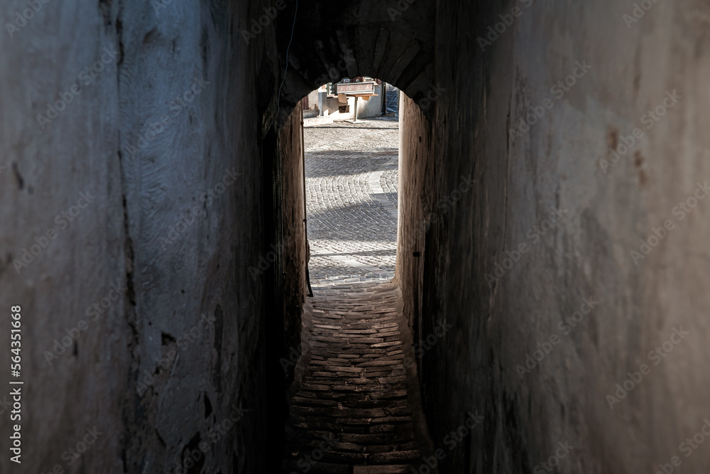 Narrow tunnel passage between buildings at Szentendre, Hungary