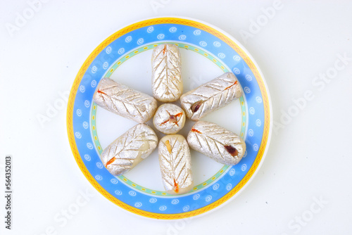 Indian delicious sweets and Mithai on a plate for festival photo