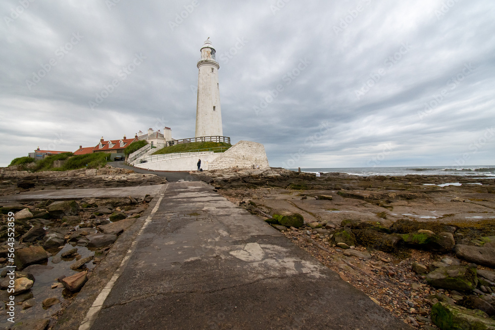 Dark cloudy skies over St Mary's LIghthouse at Whitley Bay in Tyne and Wear, UK
