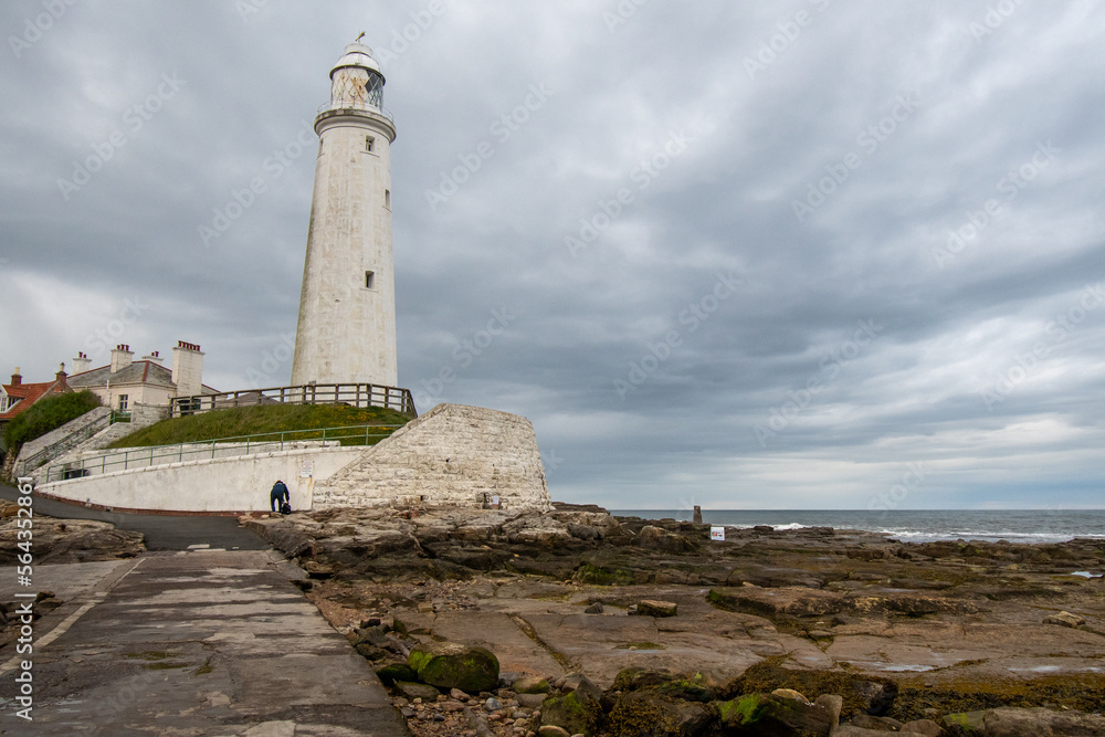 Dark cloudy skies over St Mary's LIghthouse at Whitley Bay in Tyne and Wear, UK