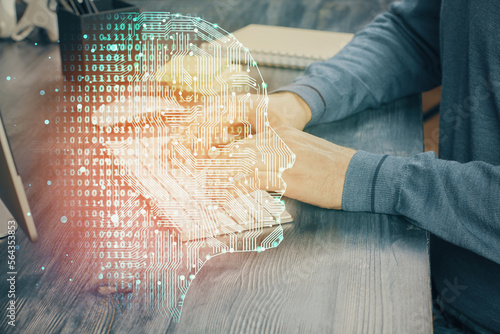 Man with computer background with brain theme hologram. Concept of brainstorm. Double exposure.