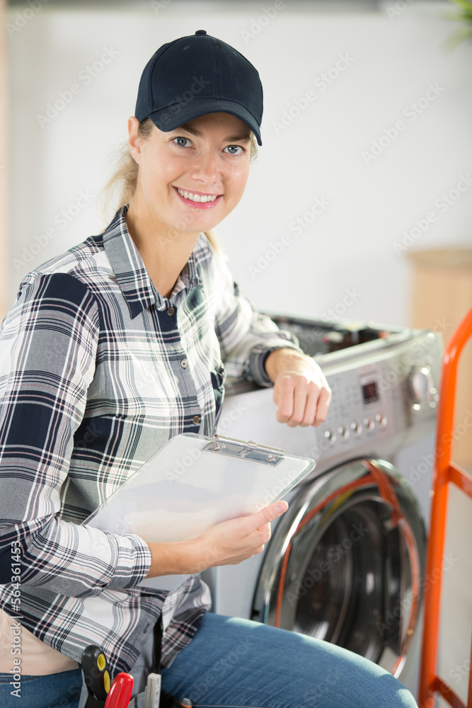 young woman delivering a washing machine
