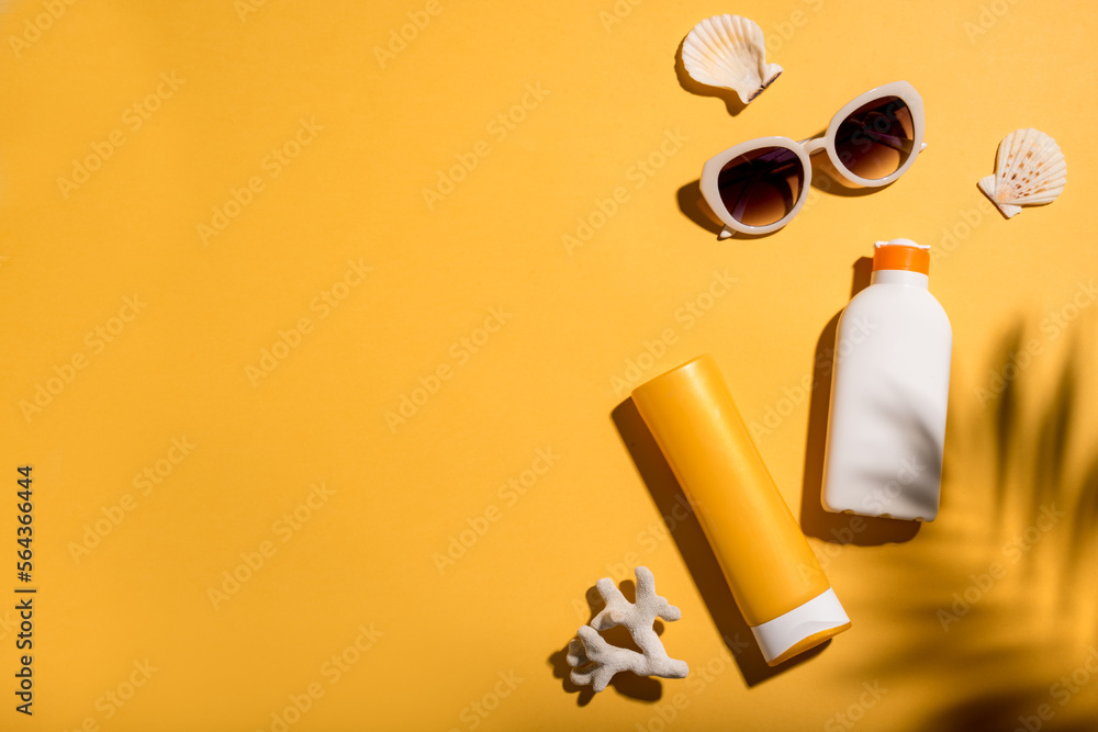 Sunblock lotion tubes and sunglasses Stock