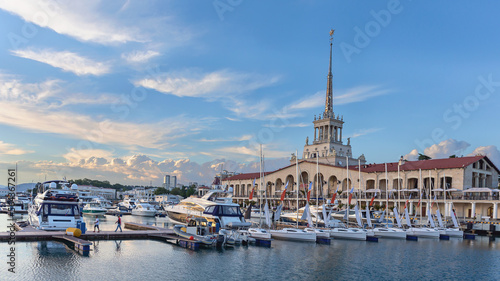 a small sailing boats in Sochi sea port on a background marine station