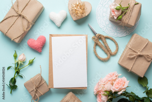 Valentine's Day lay flat. Kraft envelope with a place for text on the background of eco gifts in kraft paper.