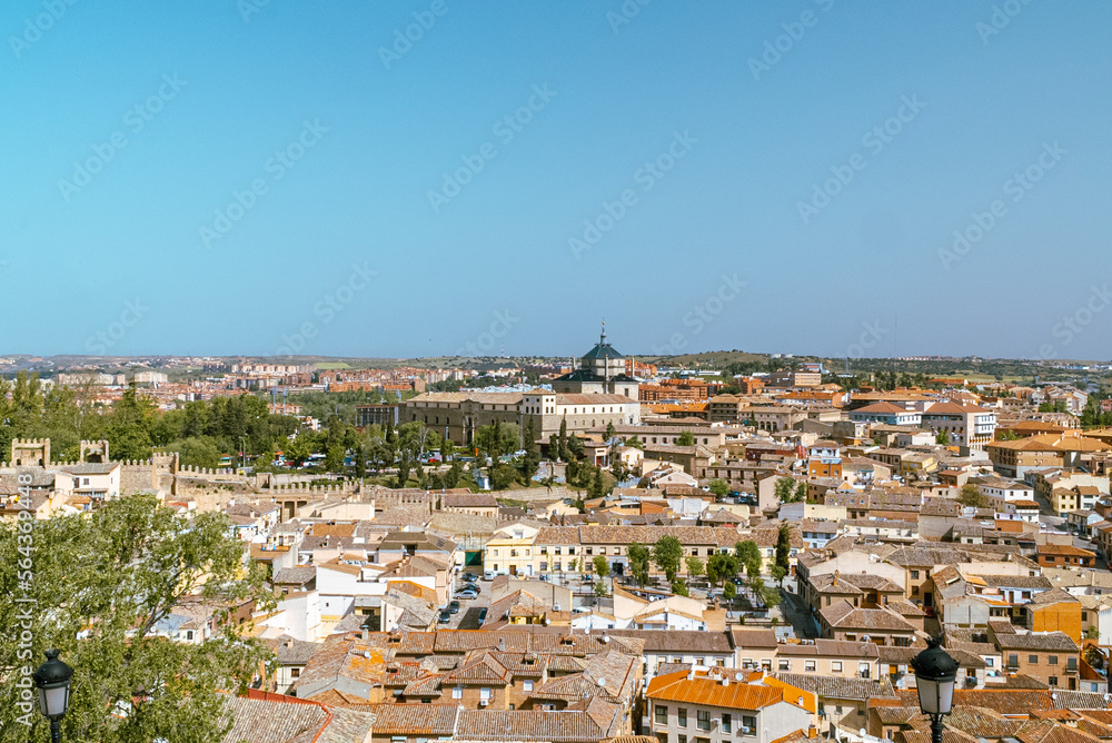 Toledo, España. April 29, 2022: Tavera Hospital and panoramic landscape with blue sky.