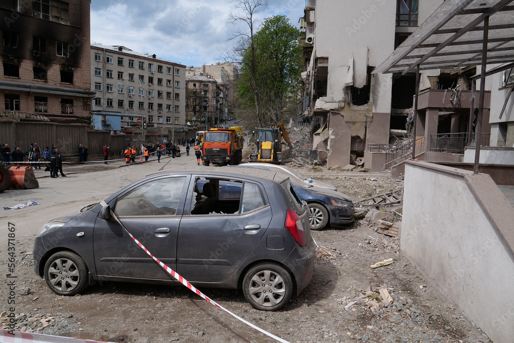 After bombing. Cars near house damaged by russian missile in Kyiv, Ukraine