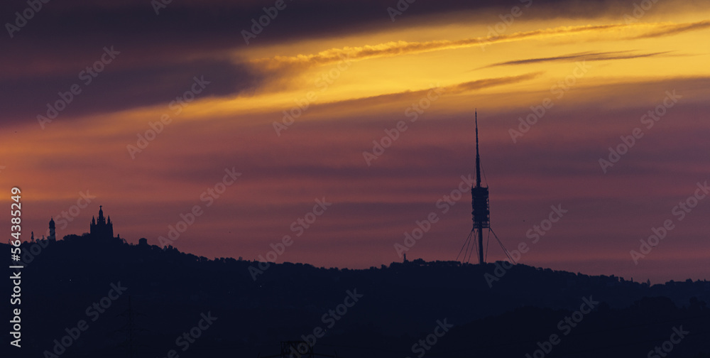 sunrise over the Collserola mountain range with the Barcelona skyline. sunrise over the Collserola mountain range with the Barcelona skyline.