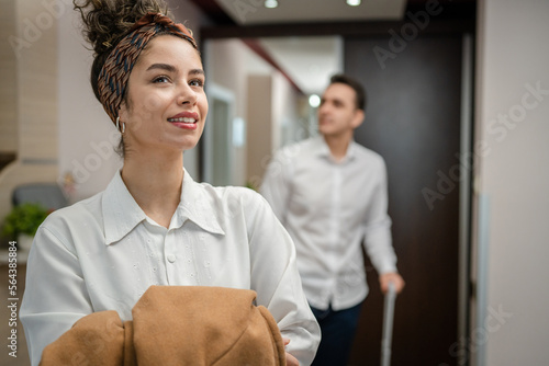 Obraz na plátně Couple woman and man wife husband enter hotel or motel room apartment