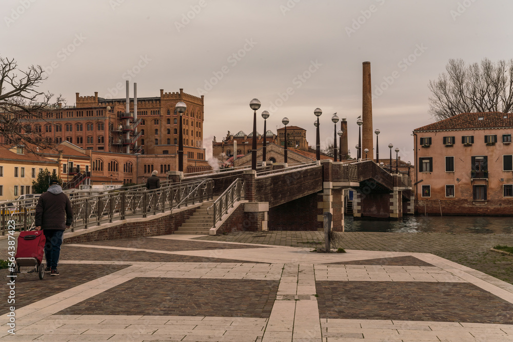 architectural detail of long bridge and industrial area in Venice, Italy 